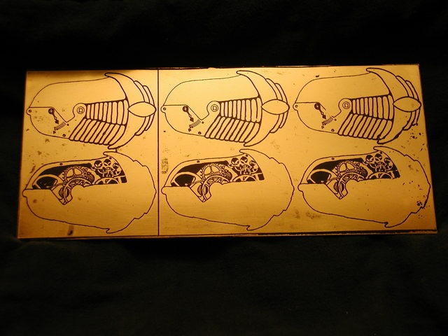 etched and painted trilobite brooches